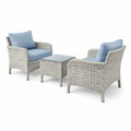 Set da giardino in rattan grigio con cuscini blu e tavolino in vetro temperato